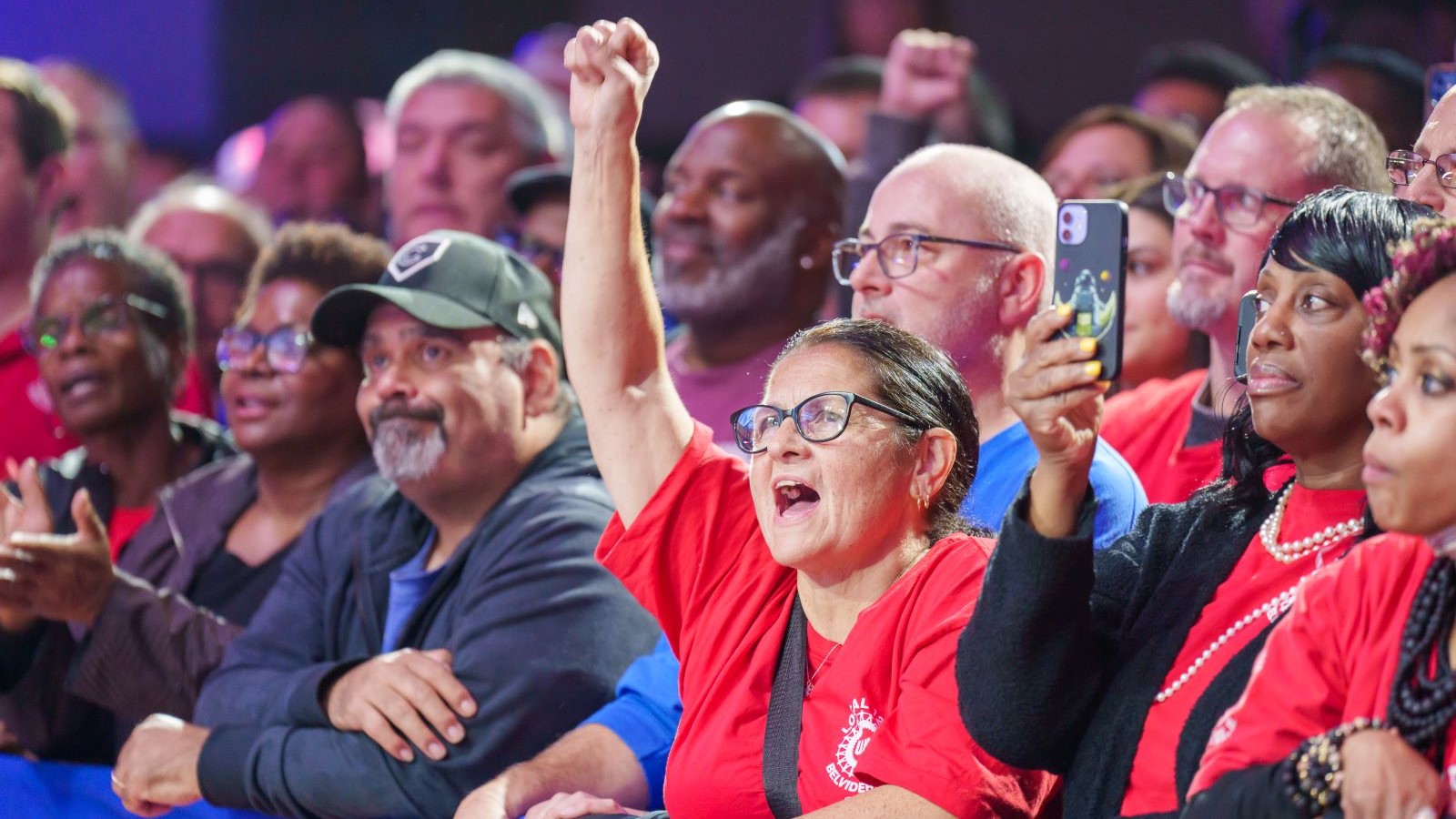 Audience cheering at President Biden's speech about creating union jobs in Illinois.