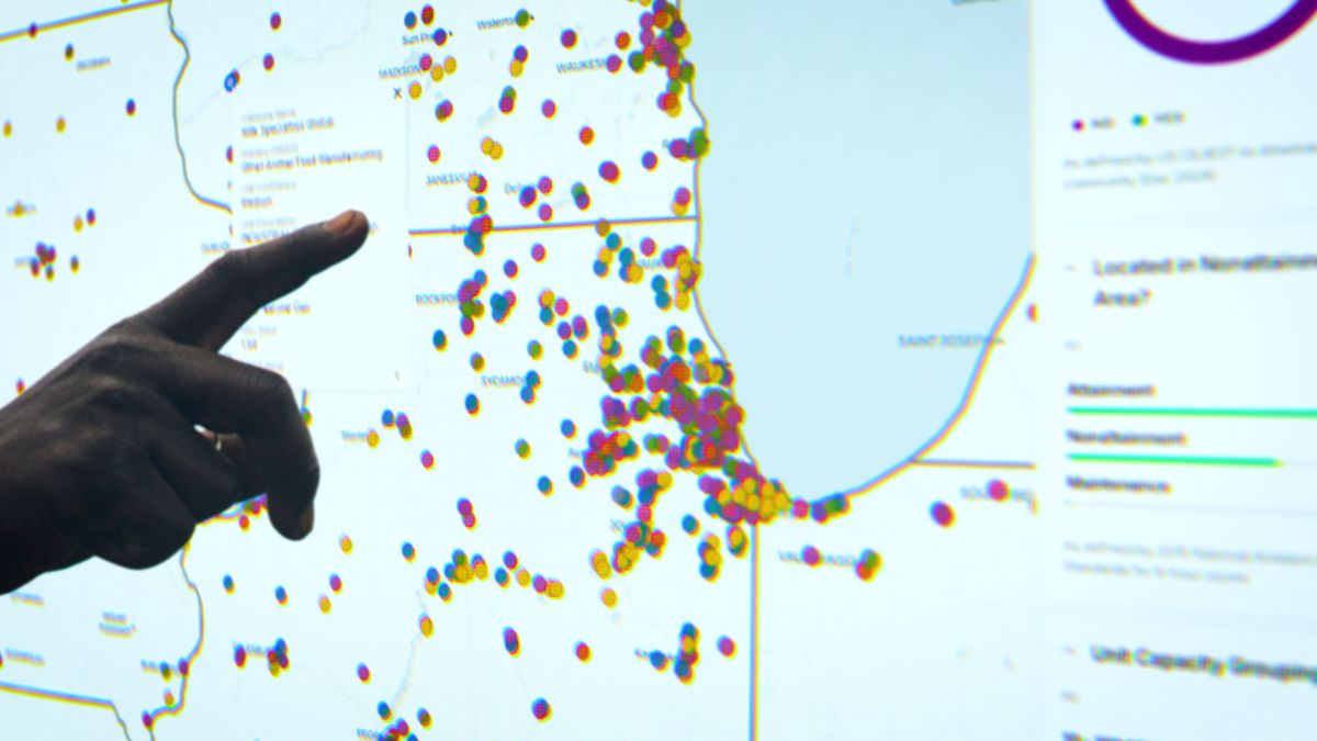 Up close shot of a finger pointing at a map of industrial boilers