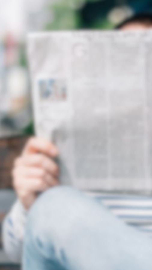 Person reading newspaper